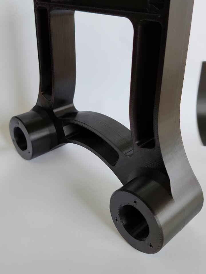 Custom load-bearing assembly part 3D printed in ABS with two bearing bosses